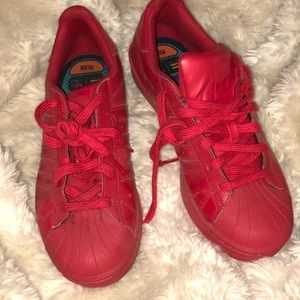 Solid red Adidas Pharrell Williams limited edition